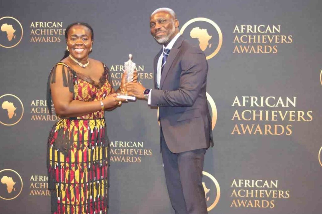 Elsie Appau-Klu receiving award at UK Parliament House of Lords