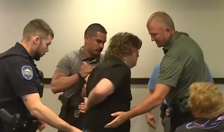 Kansas Teacher Arrested for Clapping at Public Data Center Hearing